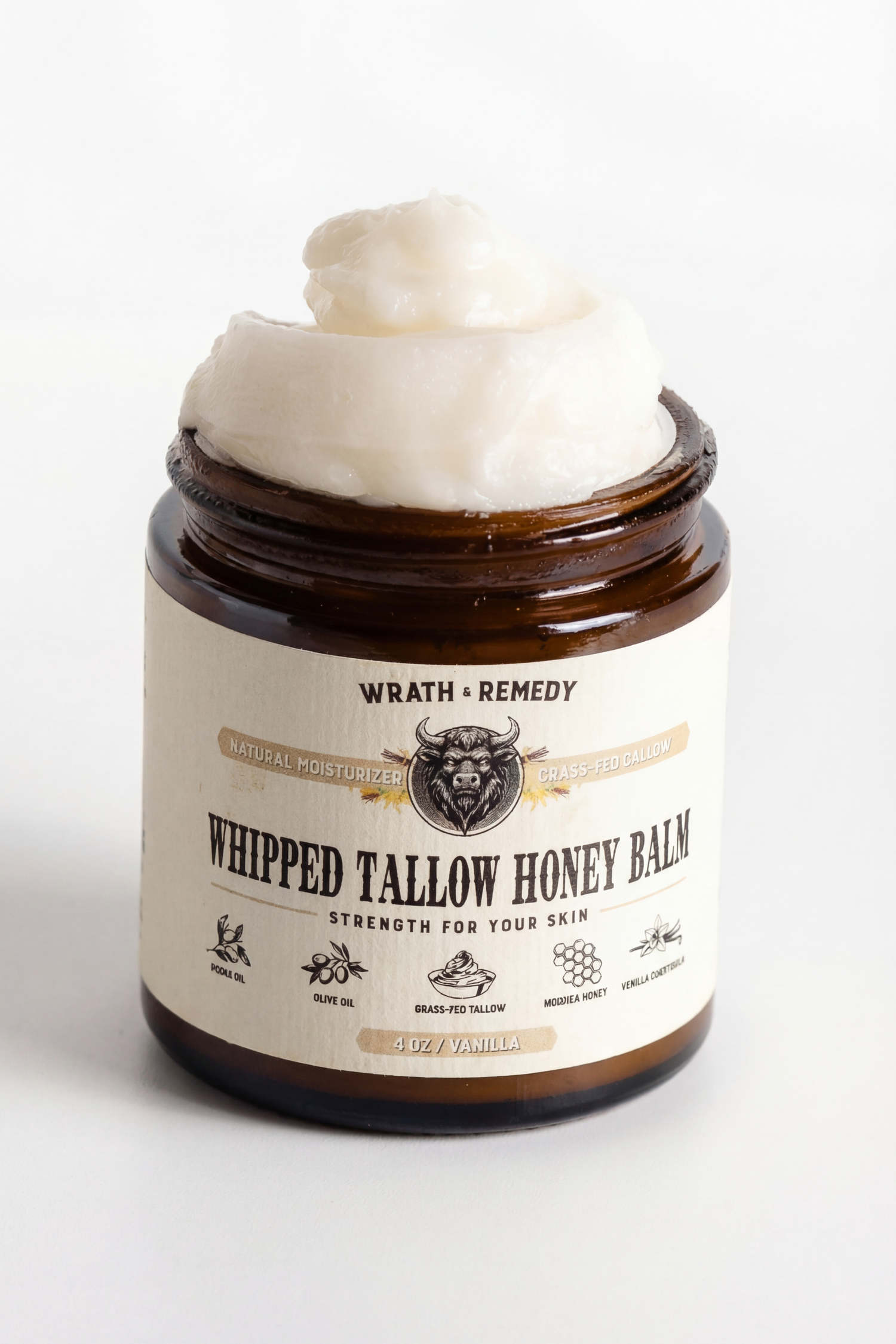 Jar of whipped tallow honey balm with visible brand label on a white background