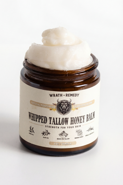 Jar of whipped tallow honey balm with visible brand label on a white background